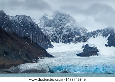 Glacier landscape of Spitsbergen, blue ice sea mountains