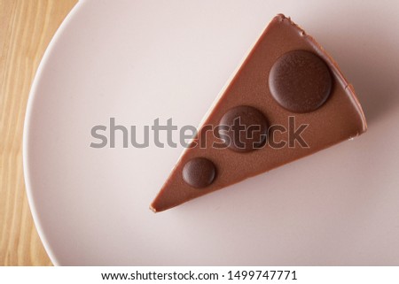 chocolate cake white and dark chocolate on a pink plate