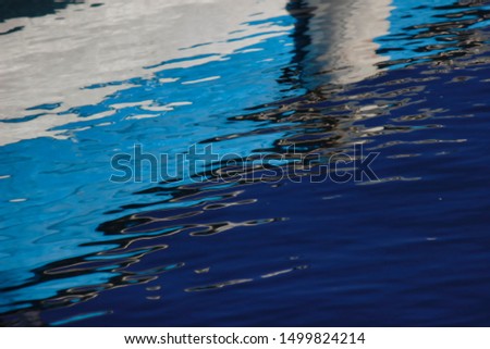 reflections in the sea, in various colors and shapes