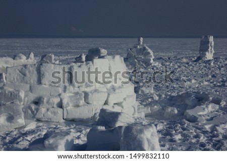 Winter landscape with ice igloo on white snow background.