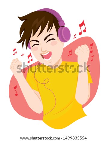 Happy teenager man listening to music and dancing using big headphones