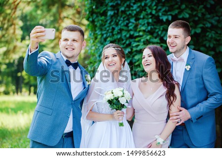 Friends of the bride and groom take a selfie