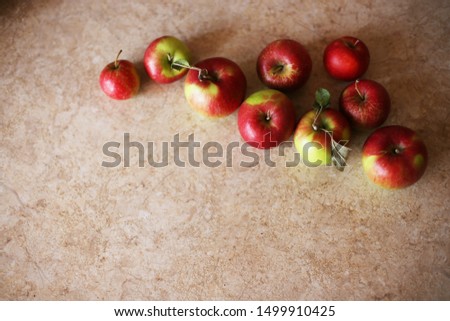 Red and green Apple on the Wooden Table. Harvest farm fruits, rustic background