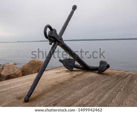 Huge old rusty anchor at the harbor of Domsten, Sweden, close to Helsingborg.