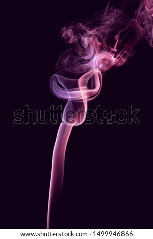 Colorful smoke against a dark background