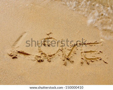 love, word drawn on the beach