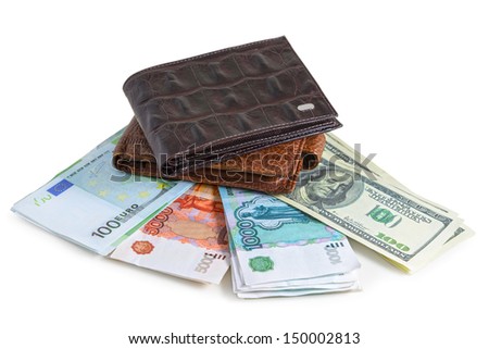 The two brown  leather wallet with euro, dollars and rubles is photographed on the close-up