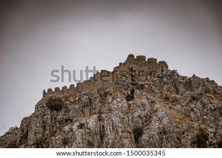 The Acrocorinth "Upper Corinth" the acropolis of ancient Corinth, is a monolithic rock overseeing the ancient city of Corinth, Greece. Its the most impressive of the acropoleis of mainland Greece Royalty-Free Stock Photo #1500035345