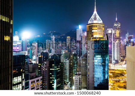 Modern buildings at night in Hong Kong.