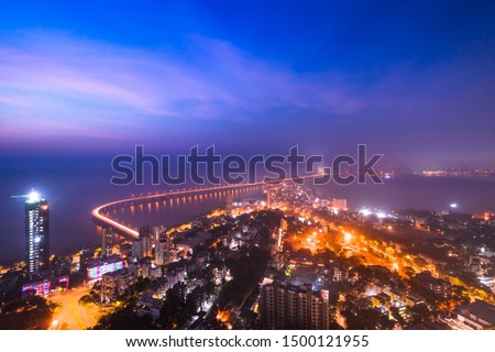 The Bandra Worli Sea link snaking across the Arabian Sea and Mahim Bay, from Worli to Bandra. Parts of Worli and Bandra can be seen in the picture. Royalty-Free Stock Photo #1500121955