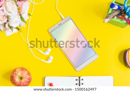 Mockup blank screen mobile phone. Flat lay yellow background office home working space.
