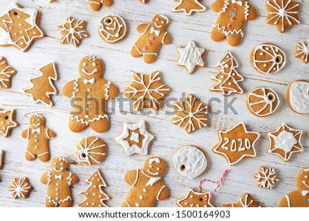 Various Christmas ginger cookies on a white background