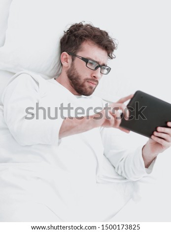 background image . modern man reading on digital tablet.