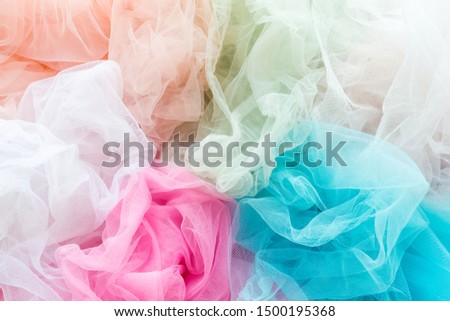 Bright and colorful tulle cloth closeup. Fabric for tutu skirt. Glamour fashionable clothes for woman and little girls