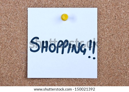 Post it note white with shopping message on cork