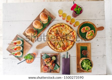 assortment on the table pizza burgers