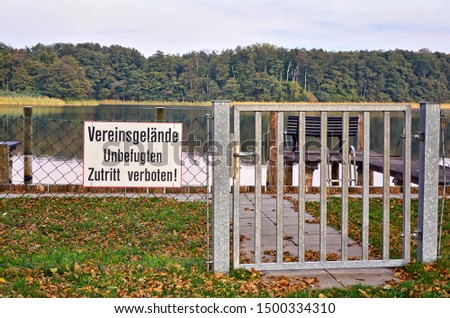 Pier for boats. Letters with Vereinsgelände Unbefugten Zutritt verboten! Means Club area Unauthorized access prohibited!