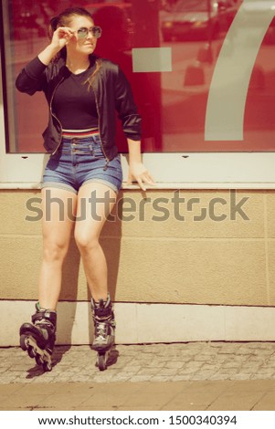 Teenage woman girl riding roller skates during summertime showing sale symbol on window.