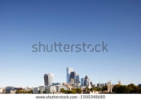 London city skyline and the financial district against clear blue sky