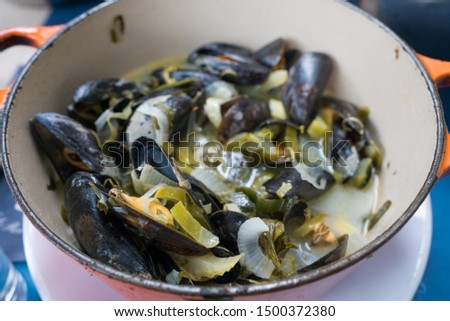 Horizontal view of traditional mussel and french fries dish called "Moules et Frites"