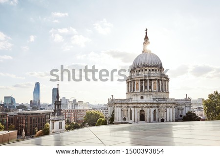Urban skyline with St. Paul Cathedral at sunset. London, United Kingdom.