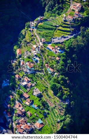 View from Eira do Serrado to Curral das Freiras village in the Nuns Valley in beautiful mountain scenery, municipality of Câmara de Lobos, Madeira island, Portugal.