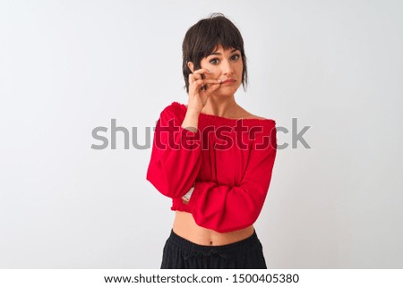 Young beautiful woman wearing red summer t-shirt standing over isolated white background mouth and lips shut as zip with fingers. Secret and silent, taboo talking