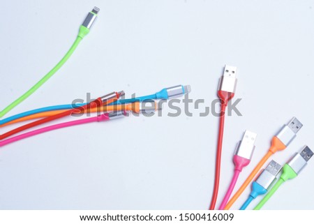 USB. Multicolored USB wires on a white background.