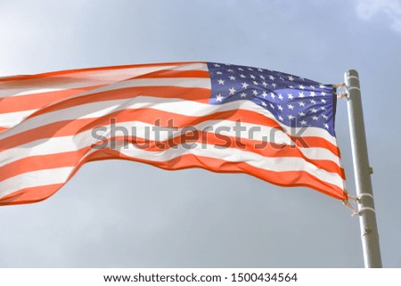 USA flag, blue sky background