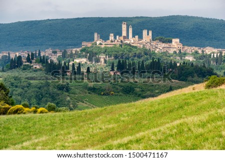 Summer landscape in the Chianti region near Poggibonsi, Siena, Tuscany, Italy with San Gimignano in background