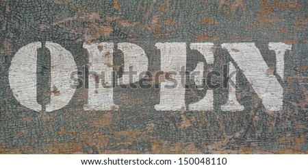 Eroded open stencil wood sign 