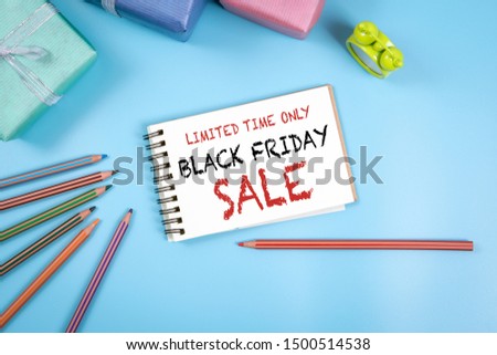 Black Friday Sale, Limited Time Only. Notepad with text, blue background