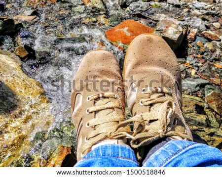 Footrests on edge of a waterfall Royalty-Free Stock Photo #1500518846