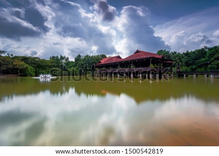 A long exposure picture of Traditional house at the lake in Johor Bahru Garden