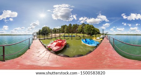 full seamless spherical hdri panorama 360 degrees angle view on wooden pier of huge lake or river with colored old vintage plastic catamarans and boats in equirectangular projection, VR content