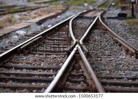 Railroad tracks with a junction on the front Royalty-Free Stock Photo #1500653177