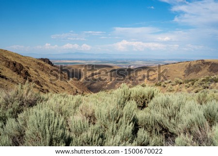 View of Southern Idaho in Owyhee County - mountains and sagebrush on a beautiful summer day Royalty-Free Stock Photo #1500670022