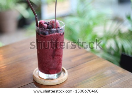 Blueberry smoothie on nature background