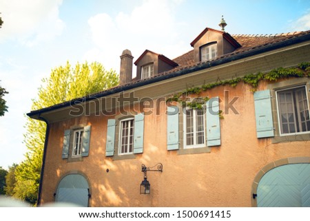 Audrey Hepburn House. Switzerland. Blue windows. Memories