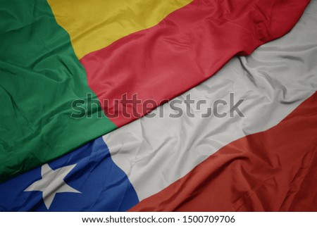 waving colorful flag of chile and national flag of benin. macro