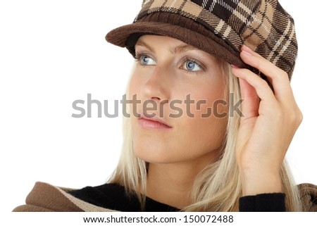 Closeup portrait of beautiful girl posing with winter hat.