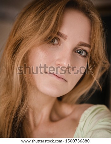 Image of excited young woman on dark background make selfie by camera.