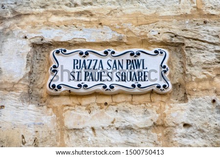 A street sign in both English and Maltese, for St. Pauls Square, in the historic city of Mdina in Malta.