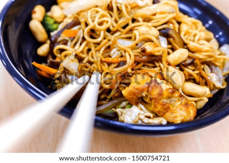 Detail of a plate of Asian noodles isolated.