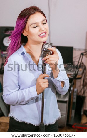 Pretty Girl Singing Into Studio Microphone.