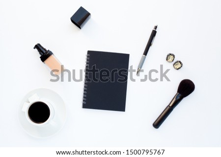 Flat lay girly, pale black items for planning, notepads, pens, office work or working at home on her laptop, on the pale white background, with place for labels. Concept Desk.