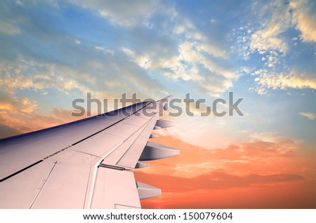Look out of the airplane window, wing Royalty-Free Stock Photo #150079604