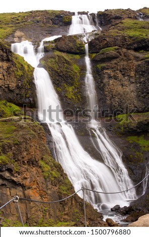 Long exposure photo of waterfall, view of the Hengifoss waterfall in Iceland, Europe. 