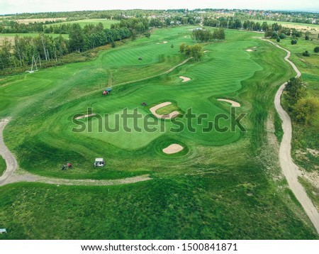 Aerial photos of Golf club, green lawns, forests, lawn mowers.