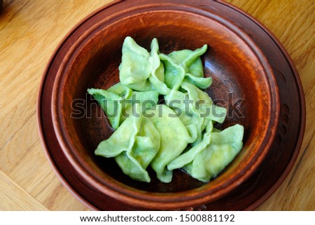 Russian pelmeni dumplings made with spinach